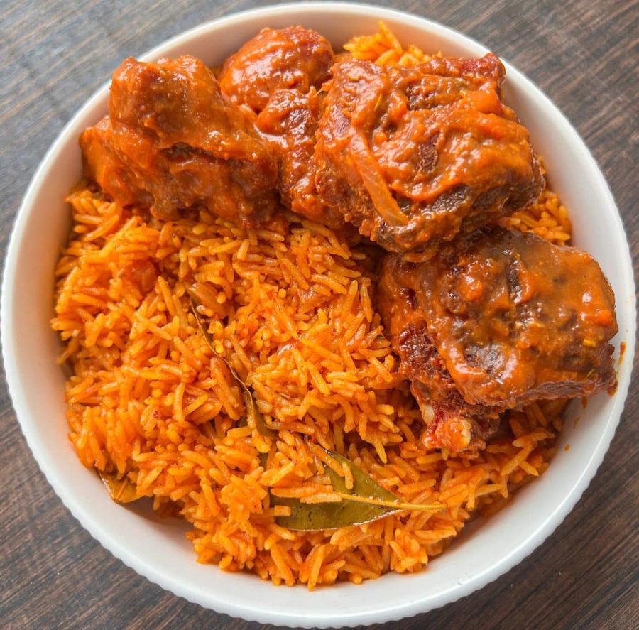 Bowl of jollof rice with meat, served at Grandma's Kitchen Montreal
